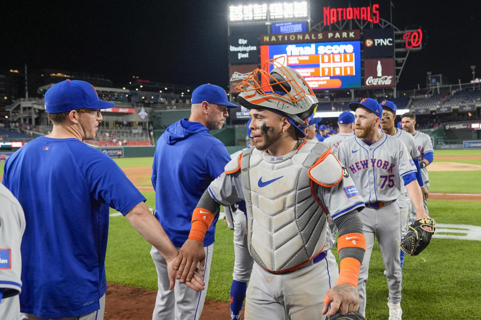 New York Mets catcher Francisco Alvarez, front right, and teammates celebrate after a baseball game against the Washington Nationals at Nationals Park, Monday, July 1, 2024, in Washington. (AP Photo/Alex Brandon)