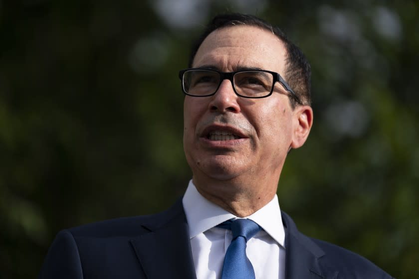Treasury Secretary Steven Mnuchin speaks with reporters about the coronavirus relief package negotiations, at the White House, Thursday, July 23, 2020, in Washington. (AP Photo/Evan Vucci)