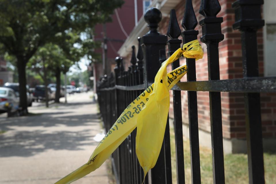 Crime scene tape remains on a fence near Holy Cross Church where Salvador Suarez was gunned down Sunday as services were ending June 20, 2016 in Chicago, Illinois. (Photo: Scott Olson/Getty Images)