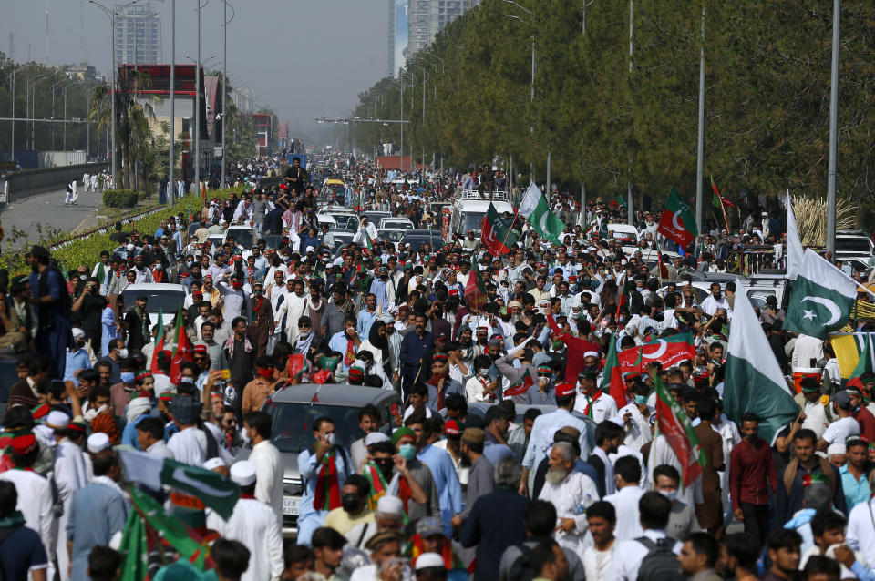 Supporters of Pakistan’s defiant former Prime Minister Imran Khan take part in an anti-government rally near parliament in Islamabad, Pakistan, Thursday, May 26, 2022. Khan early Thursday warned Pakistan's government to set new elections in the next six days or he will again march on the capital along with 3 million people. (AP Photo/Anjum Naveed)