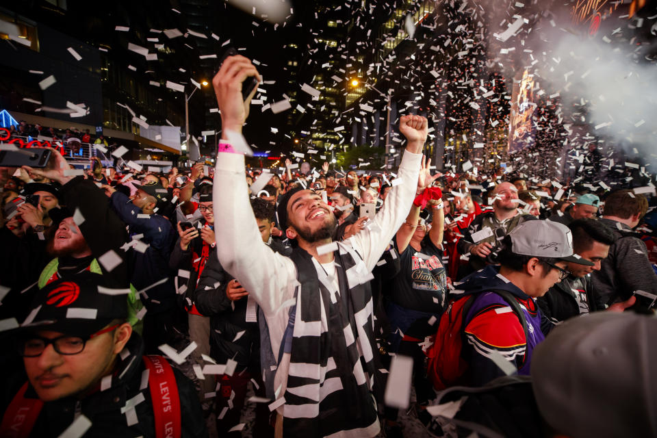 TORONTO, ON - JUNE 13: Toronto Raptors fans cheer after the Raptors defeat the Golden State Warriors in Game Six of the NBA Finals outside of Scotiabank Arena on June 13, 2019 in Toronto, Canada. (Photo by Cole Burston/Getty Images)