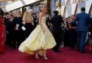 Alicia Vikander, nominated for Best Supporting Actress in "Danish Girl," wears a yellow Louis Vuitton gown as she arrives at the 88th Academy Awards in Hollywood, California February 28, 2016. REUTERS/Lucy Nicholson