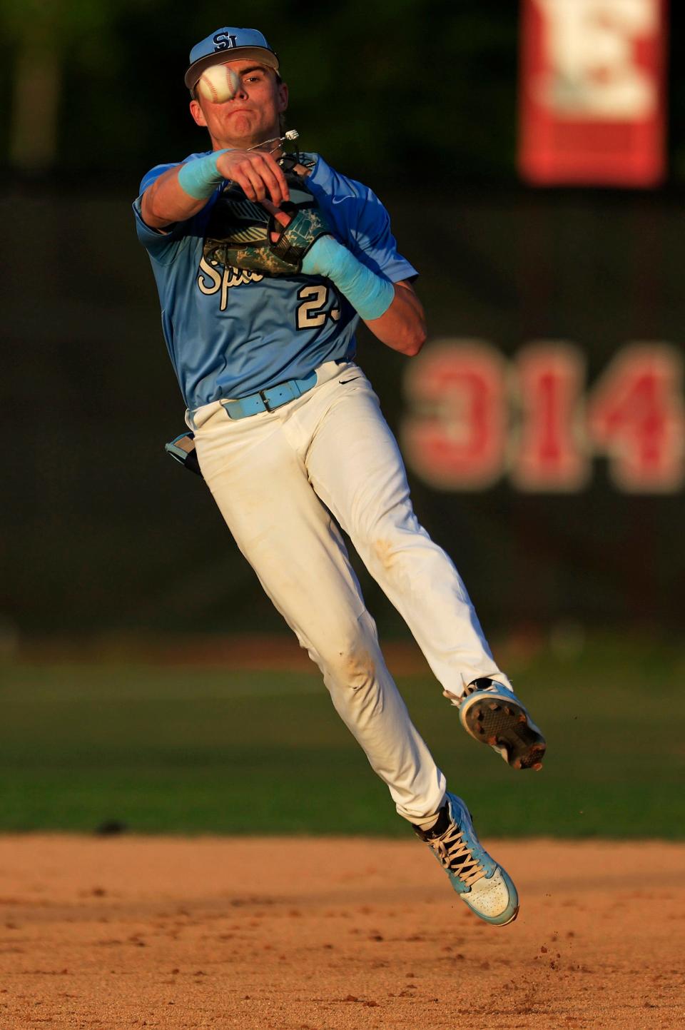 St. Johns Country Day's Kolt Myers (23) throws to first base for the out during Wednesday's game against Creekside.