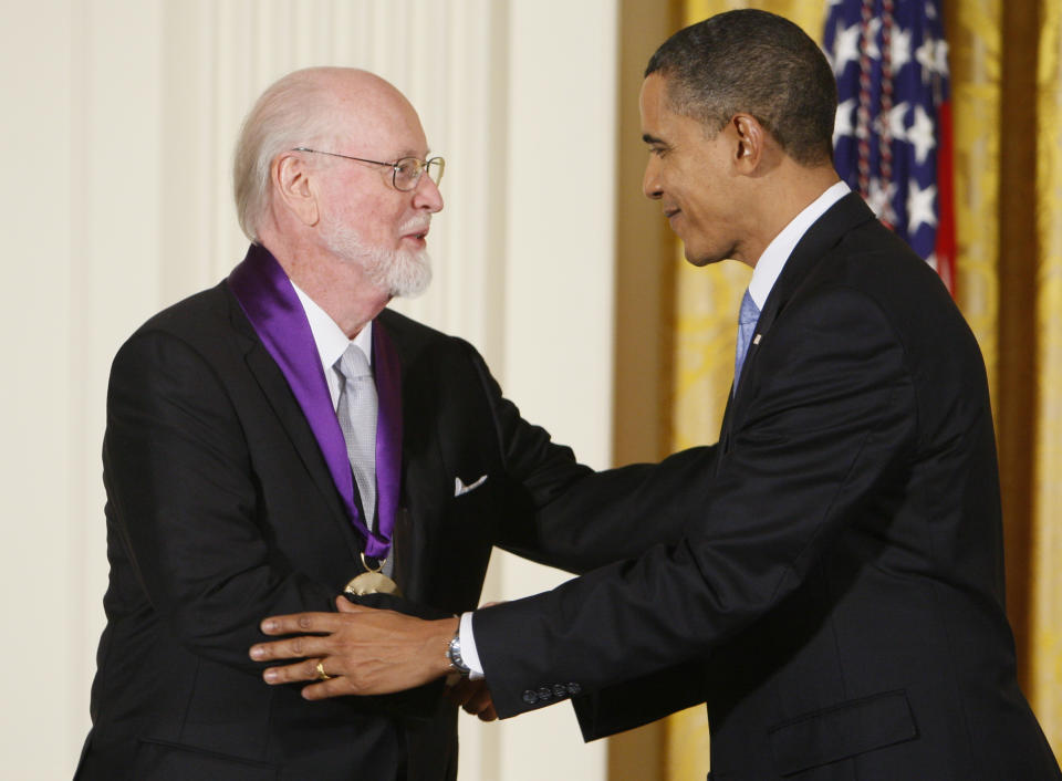 FILE - President Barack Obama presents the 2009 National Medal of Arts to John Williams in the East Room of the White House in Washington on Feb. 25, 2010. (AP Photo/Charles Dharapak, File)