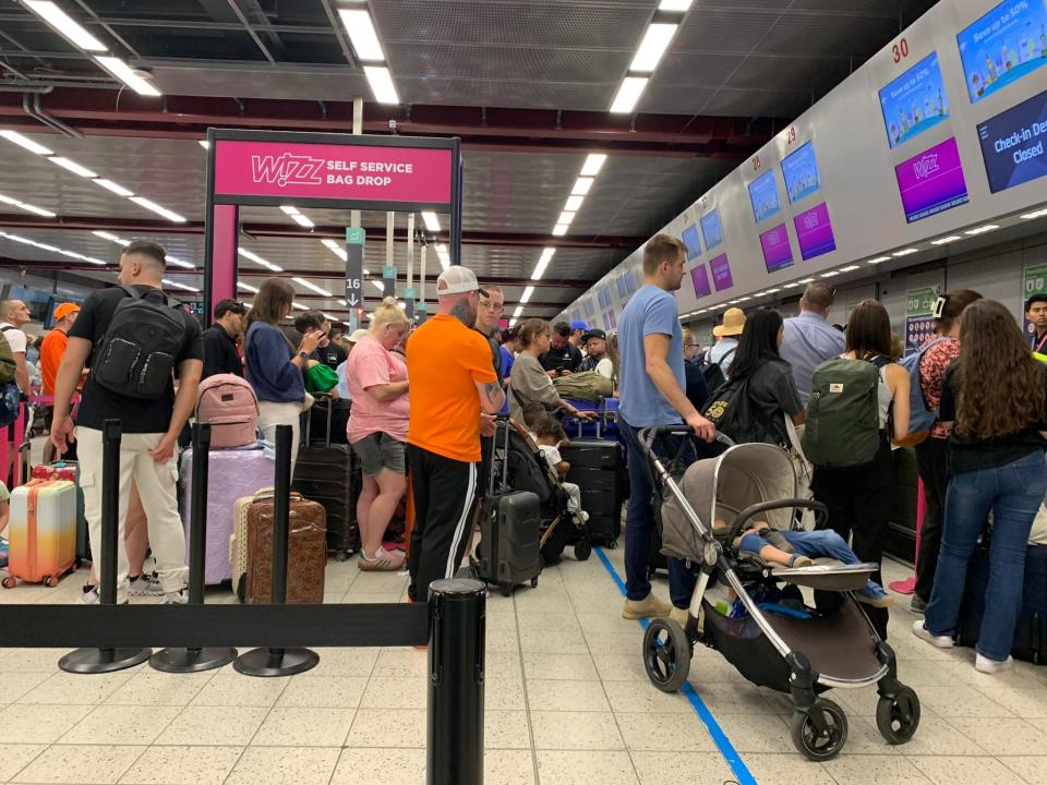 Long lines at Luton Airport, near London, on July 19, 2024, as airlines and other companies reeled from a mass IT outage.