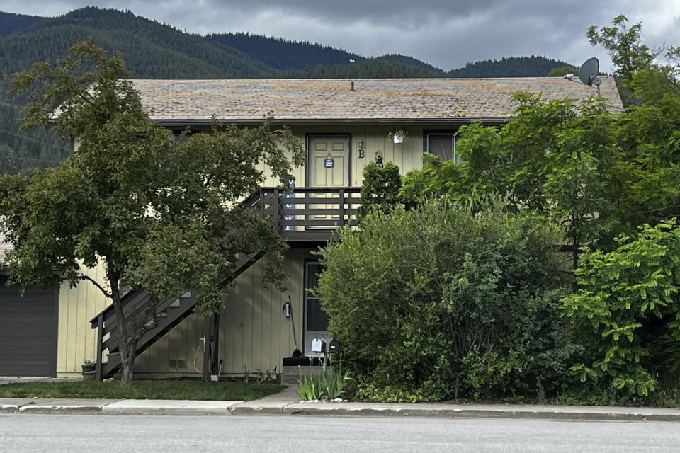 A 31-year-old man who lived in the upstairs unit of this duplex in Kellogg, Idaho, has been charged with four counts of murder after prosecutors said he shot and killed the family that lived in the downstairs unit, including one child, on June 18, 2023. Authorities have released few details about the shooting, but the Idaho State Police said in a press release that it occurred after a "dispute between neighbors." Majorjon Kaylor made his first appearance in court on Tuesday, June 20, 2023 and has not yet entered a plea. (Josh McDonald/Shoshone News-Press via AP)