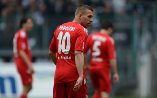 Cologne's Lukas Podolski, seen here during their German first division Bundesliga match against Borussia 'Gladbach in the German city of Moenchengladbach, on April 15. Arsenal-bound Podolski is hoping to be fit to help Cologne in their battle to stay in the German league against his former club Bayern Munich on Saturday on the last weekend of the Bundesliga