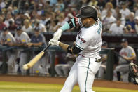 Arizona Diamondbacks' Ketel Marie hits into an infield out against the Atlanta Braves during the first inning of a baseball game, Sunday, June 4, 2023, in Phoenix. (AP Photo/Darryl Webb)