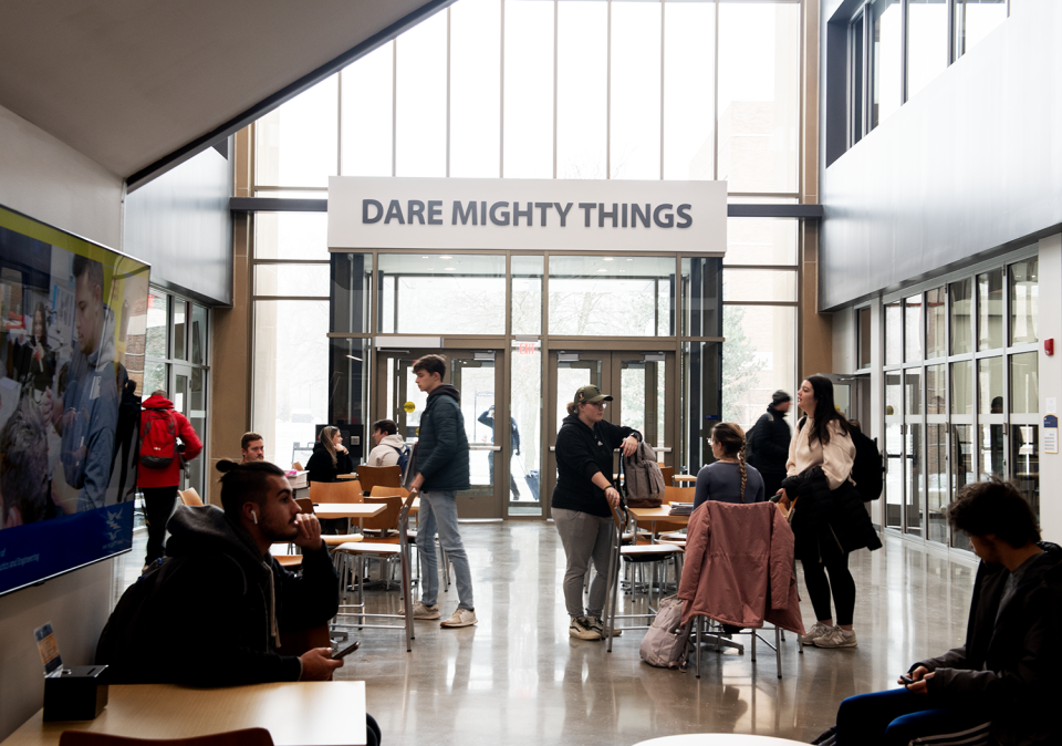 "Dare Mighty Things," a Theodore Roosevelt quote and the college's motto, is displayed above the door of the atrium entrance of the Kent State University College of Aeronautics and Engineering building, which recently underwent a multi-million dollar expansion.