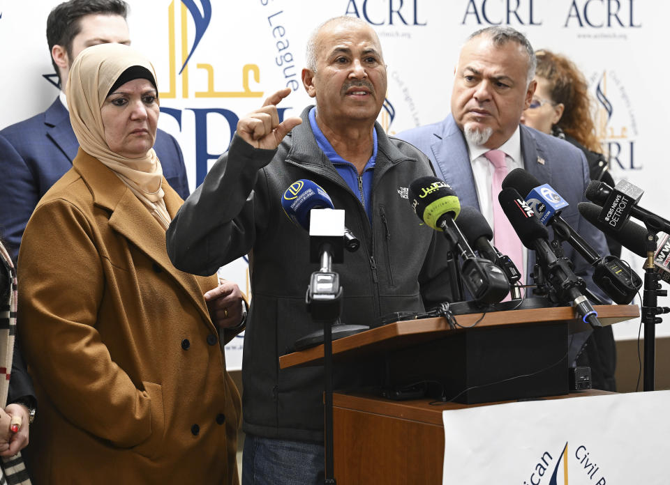 U.S. Citizens Zakaria Alarayshi, center, and his wife Laila Alarayshi, left, of Livonia, Mich., with Arab-American Civil Rights League founder Nabih Ayad, right, talk about their ordeal and experience of being stuck in Gaza during a press conference at the ACRL office, Wednesday, Nov. 8, 2023, in Dearborn, Mich. (Clarence Tabb Jr./Detroit News via AP)