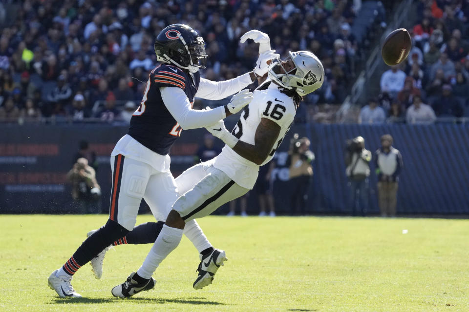 Chicago Bears cornerback Tyrique Stevenson, left, breaks up a pass intended for Las Vegas Raiders wide receiver Jakobi Meyers (16) in the first half of an NFL football game Sunday, Oct. 22, 2023, in Chicago. (AP Photo/Nam Y. Huh)