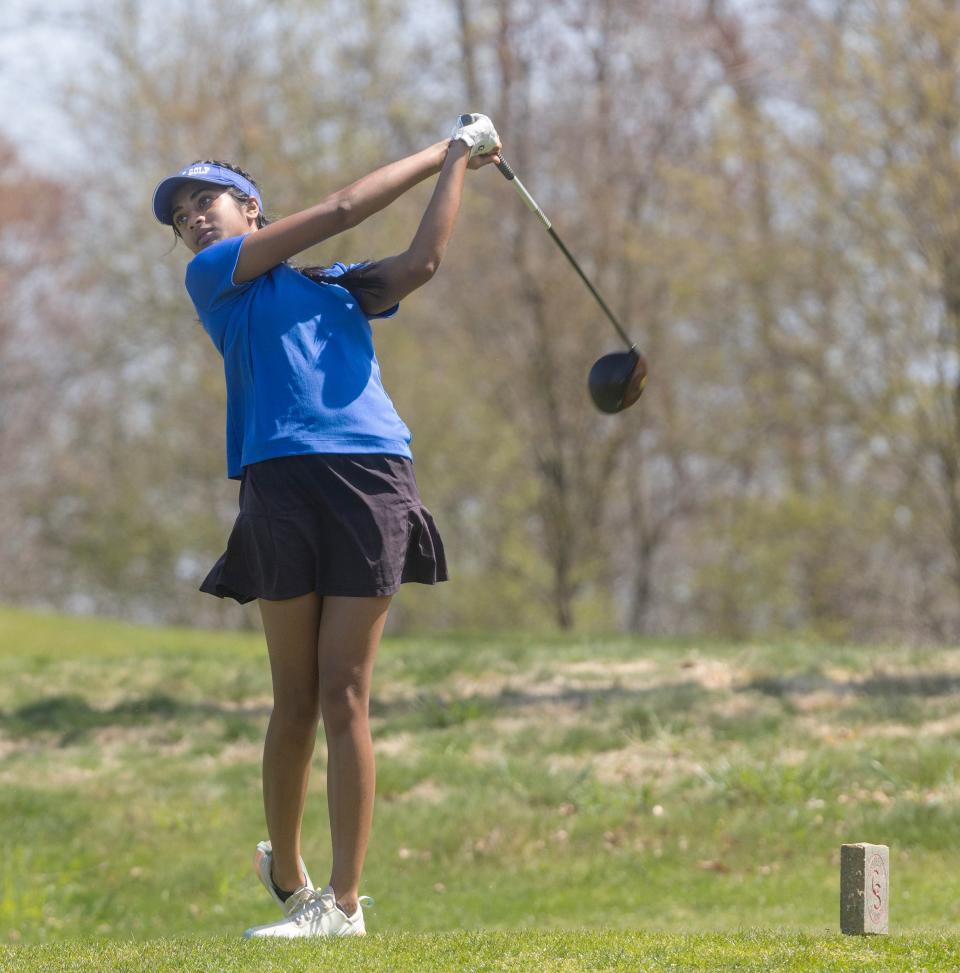 Sirina Ganne of Holmdel watches her ball as she tees off at the ninth hole. Monmouth County Girls Golf Tournament at Charleston Springs in Millstone, NJ on April 15, 2024.