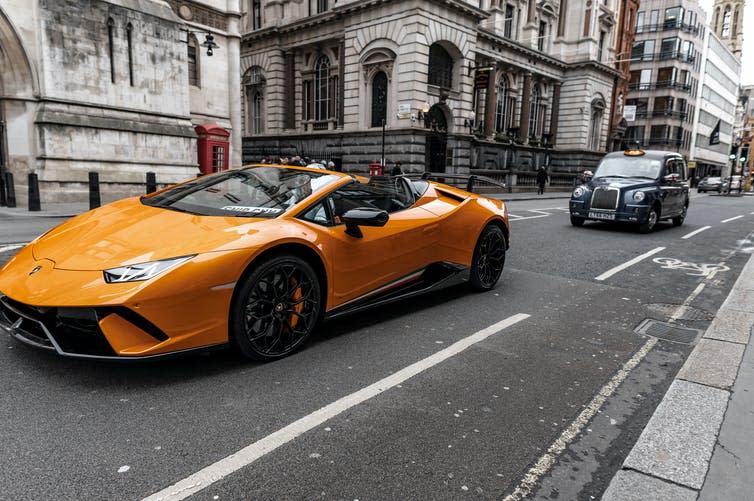 A Lamborghini sports car driving through London