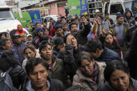 Residents protest as they wait outside a gas plant to buy propane for cooking in downtown Cusco, Peru, Friday, Feb. 3, 2023. Gas delivery trucks have been affected by anti-government demonstrators blocking highways across the country, amid political turmoil over the removal of former President Pedro Castillo who was later arrested for trying to dissolve Congress. (AP Photo/Rodrigo Abd)