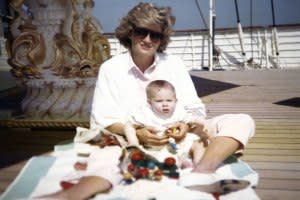 Princess Diana holding Prince Harry in a photo taken by Prince William