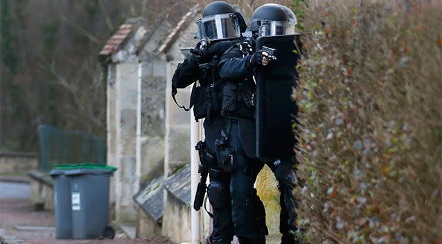 Members of the French GIPN intervention police forces secure a neighbourhood in Longpont, northeast of Paris. French anti-terrorism police converged on an area northeast of Paris on Thursday after two brothers suspected of being behind an attack on the satirical newspaper Charlie Hebdo were spotted at a petrol station in Villers-Cotterets in the region. Photo: REUTERS/Pascal Rossignol