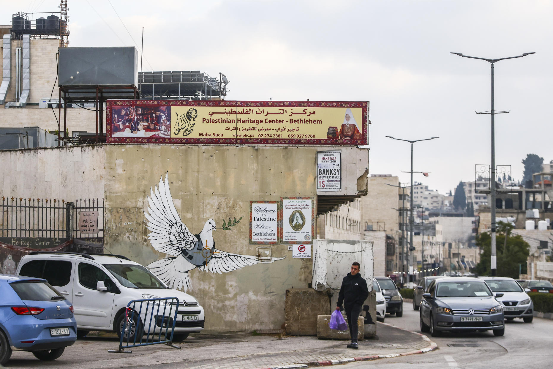 Banksy's 'The Armed Dove' street art work near Israel's West Bank wall in Bethlehem. (Getty)