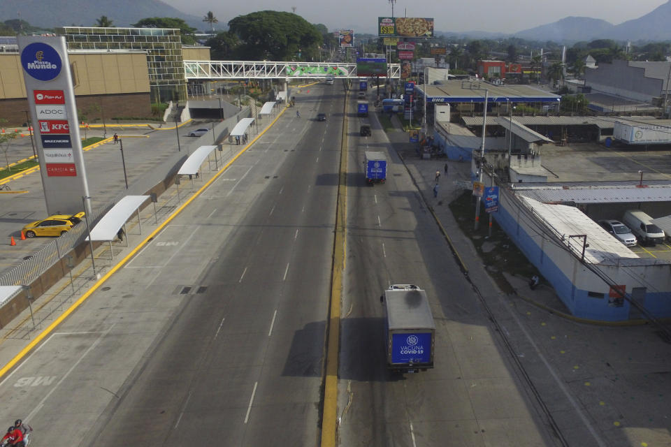 Health Ministry trucks transport doses of COVID-19 vaccines that El Salvador's government is donating and delivering to neighboring Honduras, as they depart San Salvador, El Salvador, Thursday, May 13, 2021. (AP Photo/Salvador Melendez)