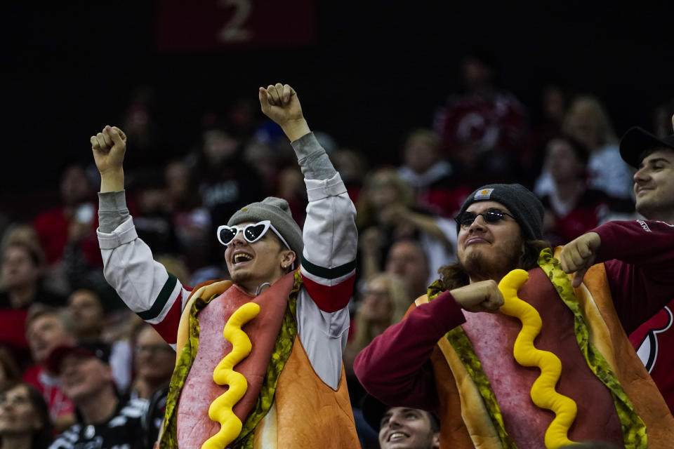 Fans attend an NHL hockey game between the New Jersey Devils and the Columbus Blue Jackets, Sunday, Oct. 30, 2022, in Newark, N.J. (AP Photo/Eduardo Munoz Alvarez)