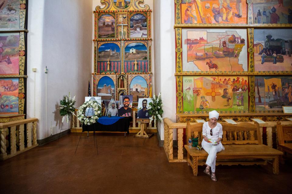 Photos of Muhammad Azfaal Hussain are displayed at “Plaza de Española” in the city of Española, New Mexico after a memorial.