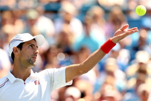 Novak Djokovic of Serbia serves to Roger Federer of Switzerland during the final of the Western & Southern Open at the Lindner Family Tennis Center in Mason, Ohio. Federer won his sixth title of the season as he beat Djokovic 6-0, 7-6 (9/7)