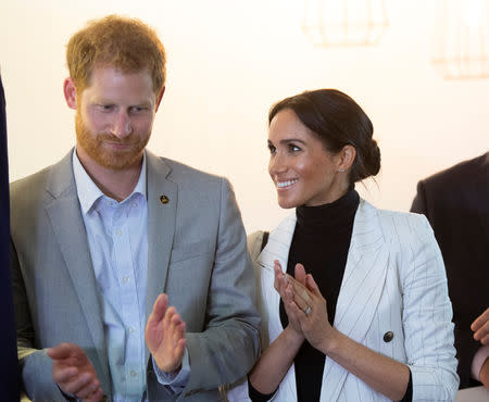 BritainÕs Prince Harry and Meghan, the Duchess of Sussex attending a lunchtime Reception hosted by the Prime Minister with Invictus Games competitors, their family and friends in the cityÕs central parkland Sydney October 21, 2018. Paul Edwards /Pool via REUTERS