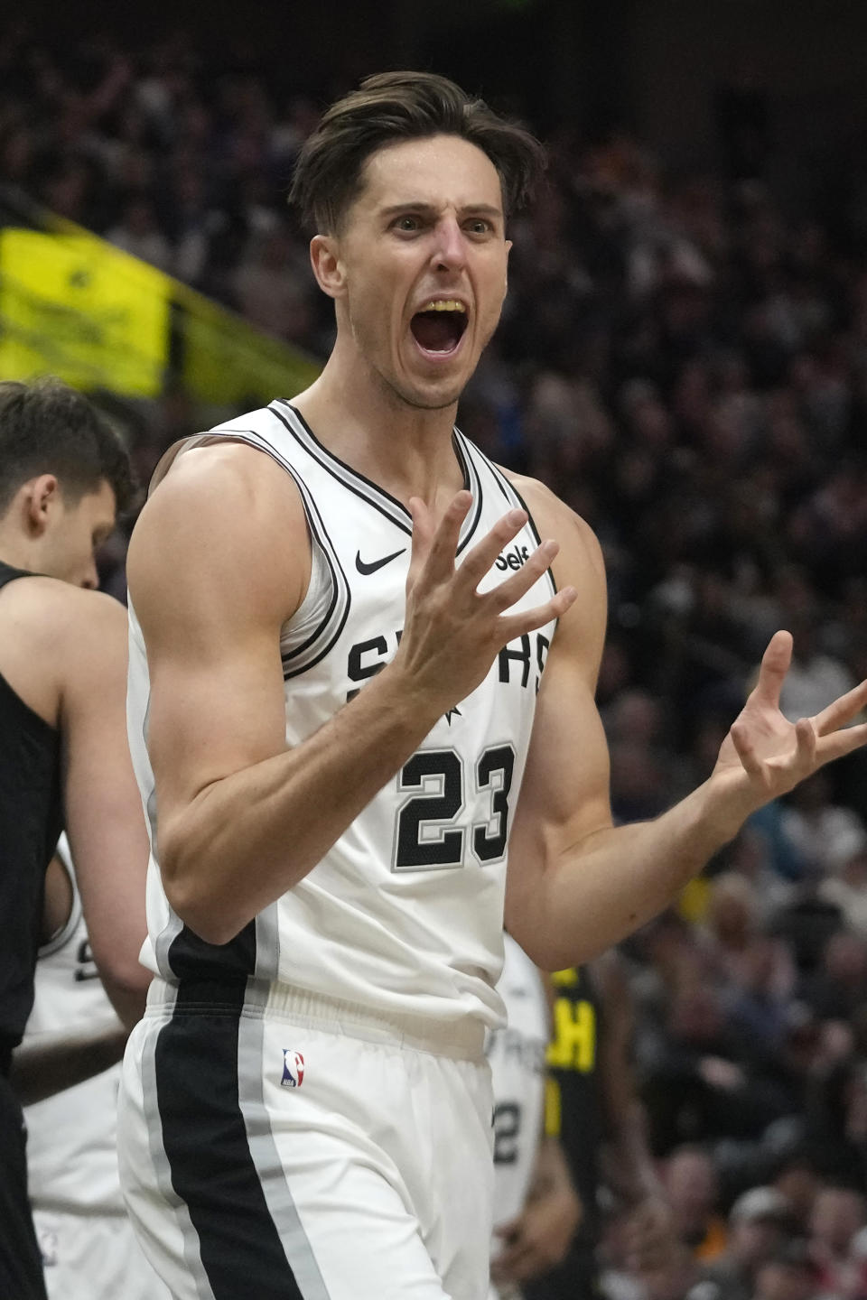 San Antonio Spurs forward Zach Collins (23) reacts after being called for a foul during the first half of an NBA basketball game against the Utah Jazz Wednesday, March 27, 2024, in Salt Lake City. (AP Photo/Rick Bowmer)