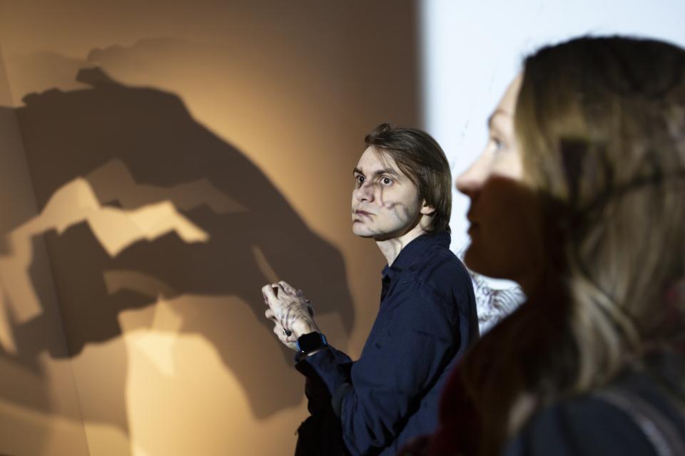 In this photo taken on Monday, March 18, 2019, visitors look at an installation by Anatoly Zverev at the AZ Museum, in Moscow, Russia. The AZ Museum was opened in 2015 in Moscow, named after Anatoly Zverev whose portrait of a young woman was Natalia Opaleva's first purchase. (AP Photo/Alexander Zemlianichenko)