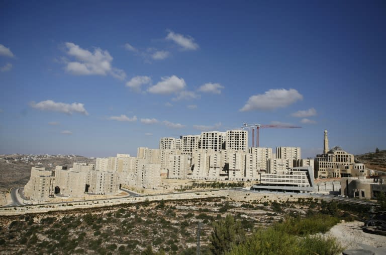 The developer has turned a vacant hillside of shrubs and sand into a city of gleaming residential streets and cafes