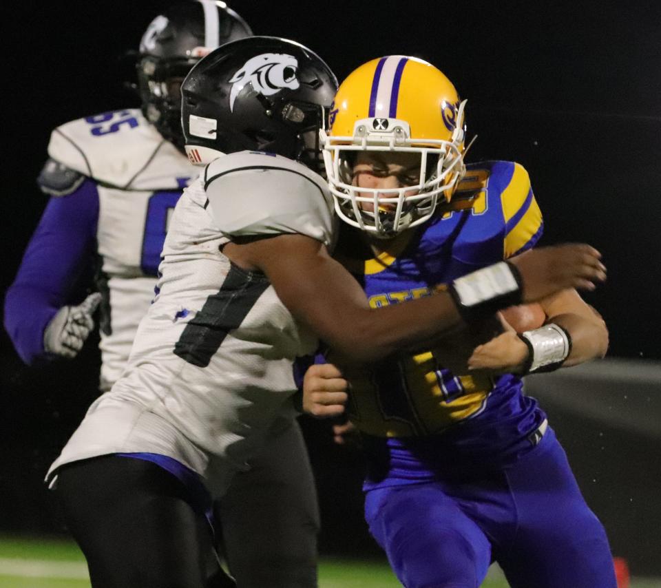 Hull's Nick Tiani runs the football in a game against KIPP Academy at Hull High School on Friday, November 12, 2021.