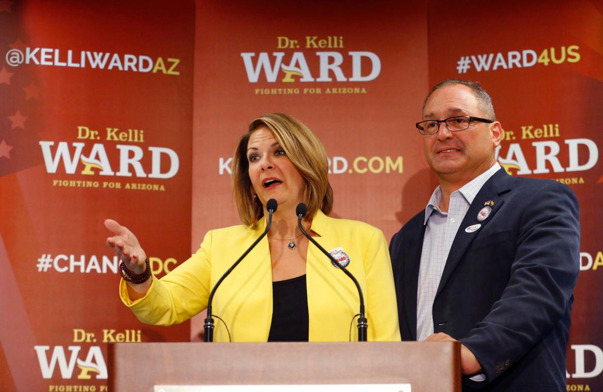 Kelli Ward, with her husband Mike at her side, concedes to Sen. John McCain, R-Ariz. in the race for the Republican nomination to U.S. Senate, at her primary night party at a hotel in Scottsdale, Ariz., on Aug. 30, 2016.