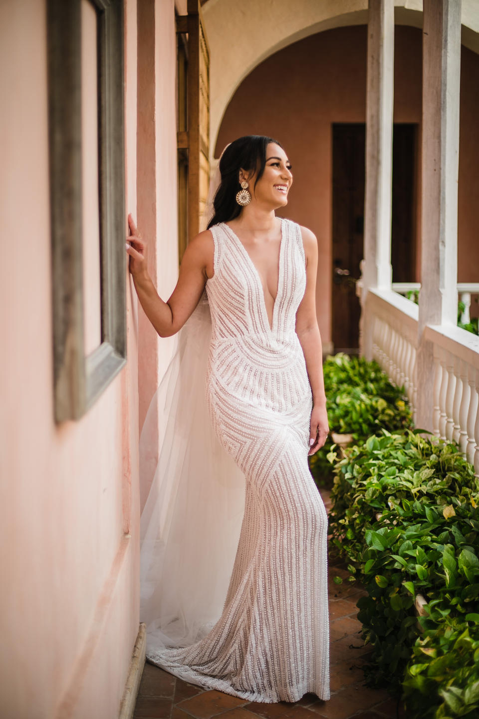 Radford paired the fairytale-worthy dress with a long veil and statement earrings, and kept the rest of her look simple with an all-natural makeup look and her hair loose around her shoulders. 
 (Marissa Joy Daly / Marissa Joy Photography)