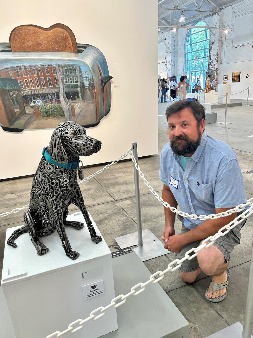 The Arts Garage artist Jeff Jackson recently won an Ohio Arts Council award at the Ohio State Fair in Columbus for this intricate sculpture of a dog made of bolts and nuts named “Bolt”.