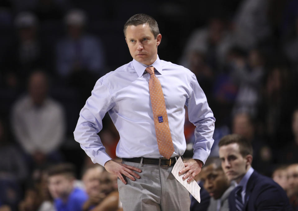 Florida head coach Mike White looks onto the court during the first half of an NCAA college basketball game against Baylor, Saturday, Jan. 25, 2020, in Gainesville, Fla. (AP Photo/Matt Stamey)