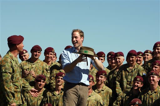 Britains' Prince William interacts with members of the 3rd Battalion, Royal Australian Regiment during his unofficial visit to Sydney, Wednesday, Jan. 20, 2010. ( AP Photo/Rick Stevens, Pool)