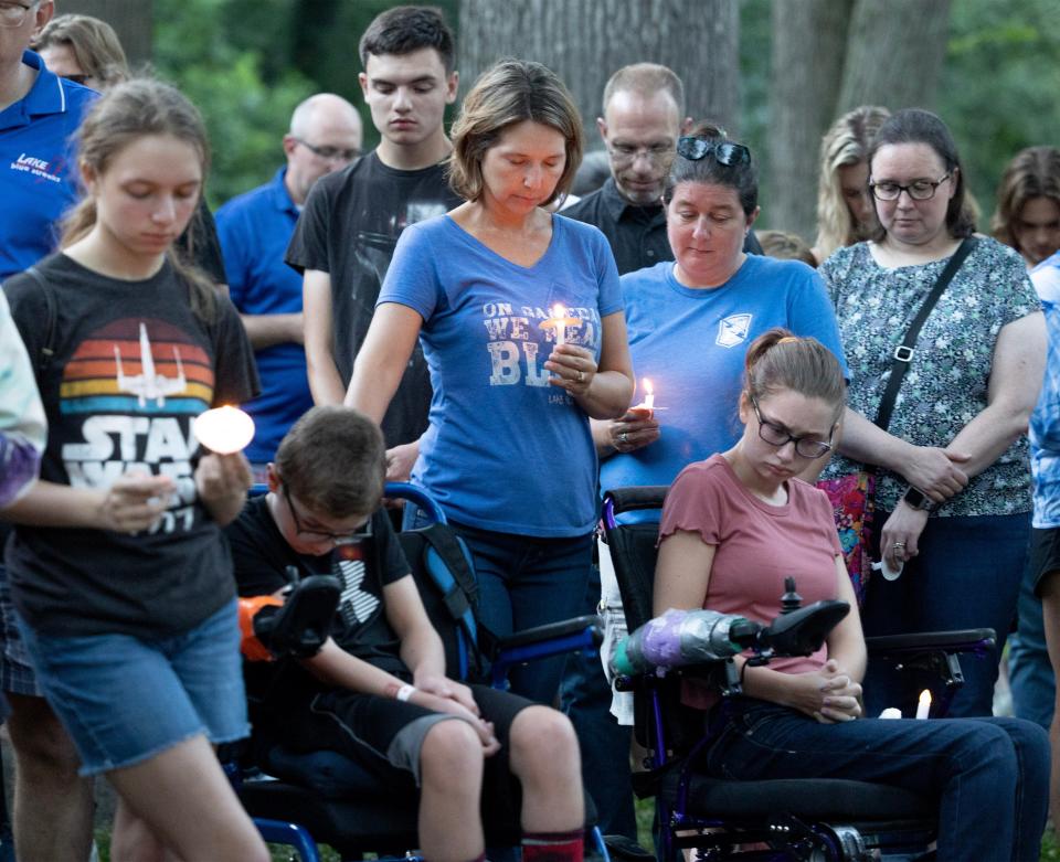 A moment of silence was observed Saturday for the Dunham family during a candlelight vigil for the family at Hartville Memorial Park. All five members of the family died this week in what police describe as a homicide-suicide.