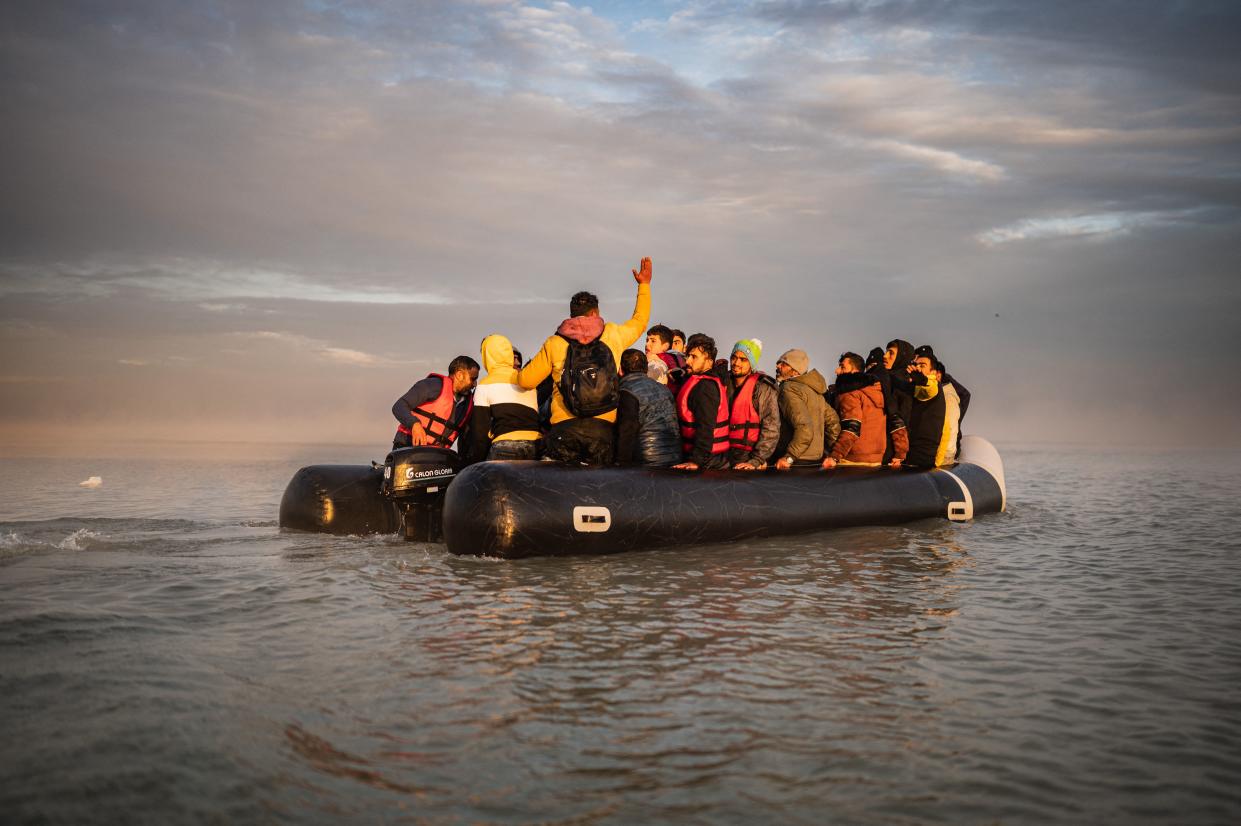 TOPSHOT - Migrants sail after boarding a smuggler's boat on the beach of Gravelines, near Dunkirk, northern France on October 12, 2022, in an attempt to cross the English Channel. - Since the beginning of the year, more than 33,500 people have already made the perilous crossing of the English Channel, one of the busiest shipping lanes in the world, where more than 400 commercial ships pass each day. (Photo by Sameer Al-DOUMY / AFP) (Photo by SAMEER AL-DOUMY/AFP via Getty Images)