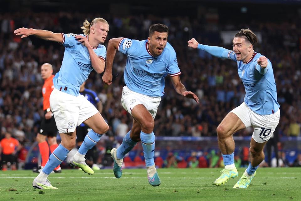 Rodri, centre, celebrates after scoring City’s goal during the Champions League final (Getty)