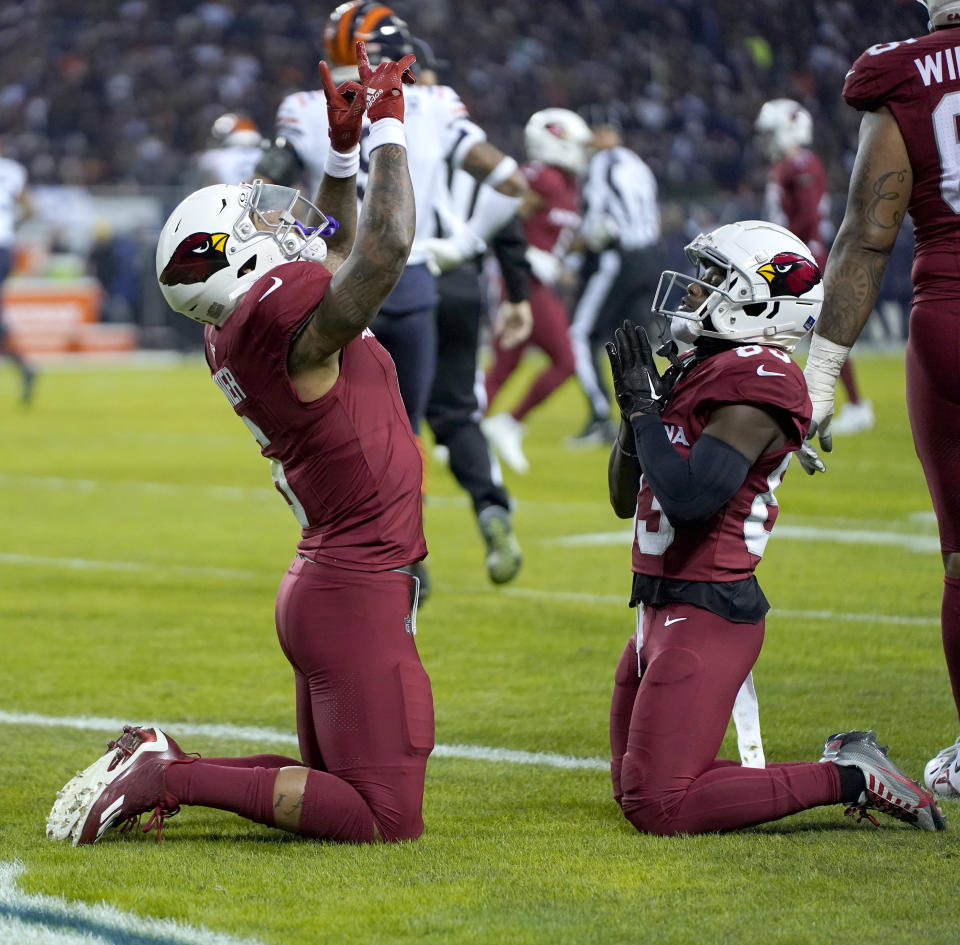 Arizona Cardinals running back James Conner, left, celebrates his touchdown with wide receiver Greg Dortch during the first half of an NFL football game against the Chicago Bears Sunday, Dec. 24, 2023, in Chicago. (AP Photo/Erin Hooley)