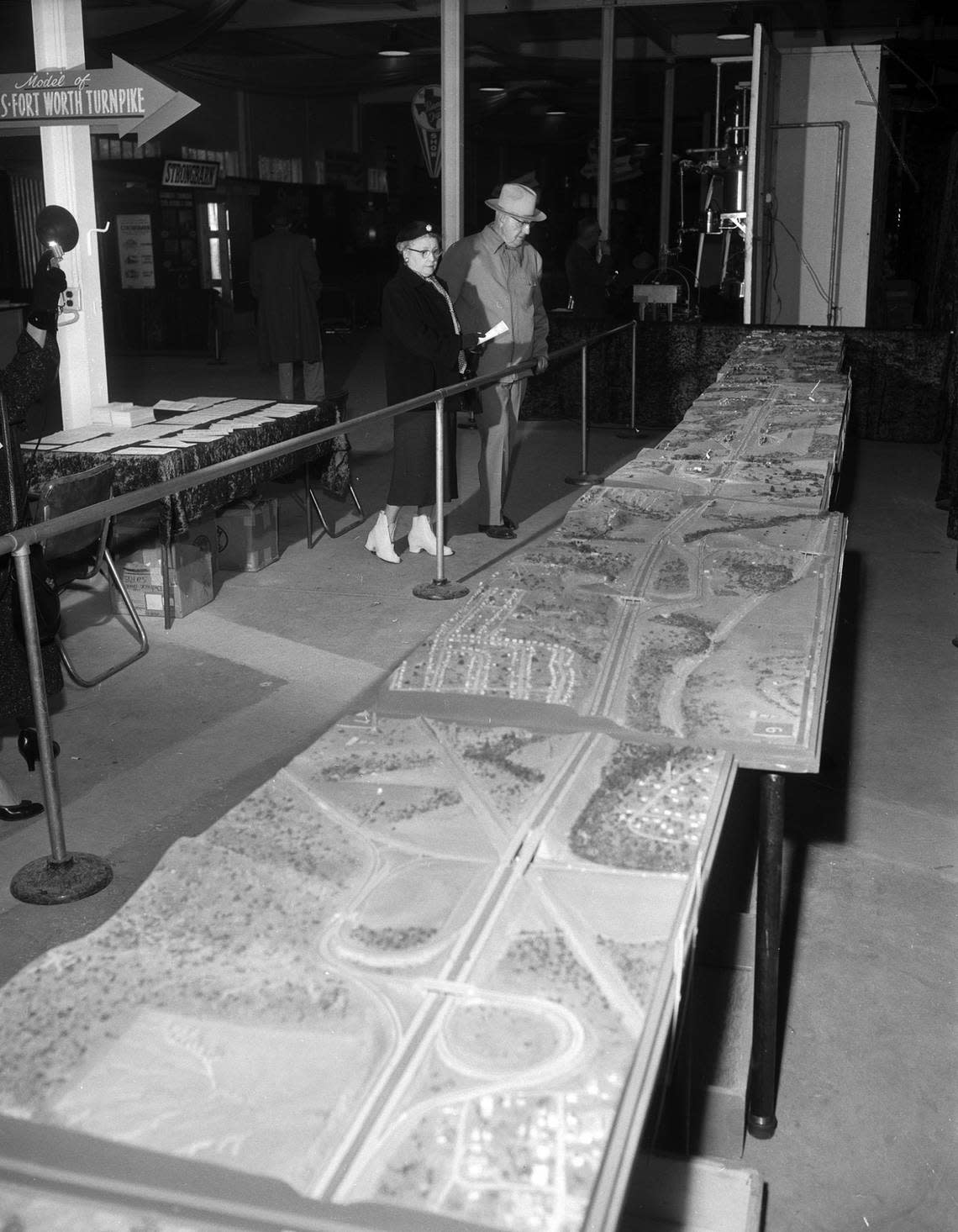 July 31, 1956: Mr. and Mrs. A.F. Buck look at a scale model of the proposed Dallas-Fort Worth Turnpike at the Southwestern Exposition and Fat Stock Show (today the Fort Worth Stock Show & Rodeo)