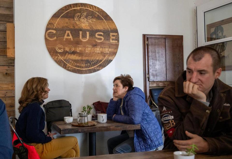 Customers chat at Cause Coffee, a De Soto coffee shop that opened in 2018.