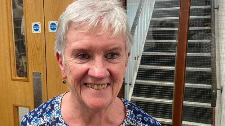 Teresa MacKay wearing a blue blouse. 