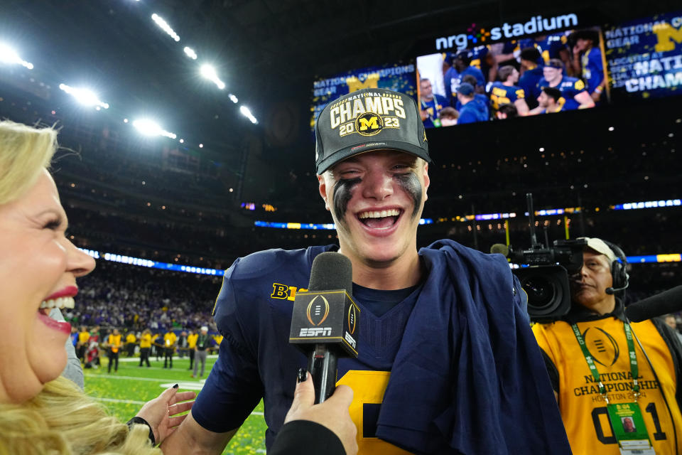College Football: CFP National Championship: Michigan quarterback JJ McCarthy (9) in action, victorious after the game while being interviewed by ESPN broadcaster Holly Rowe vs Washington at NRG Stadium. Houston, TX 1/8/2024 CREDIT: Erick W. Rasco (Photo by Erick W. Rasco/Sports Illustrated via Getty Images) (Set Number: X164476 TK1)