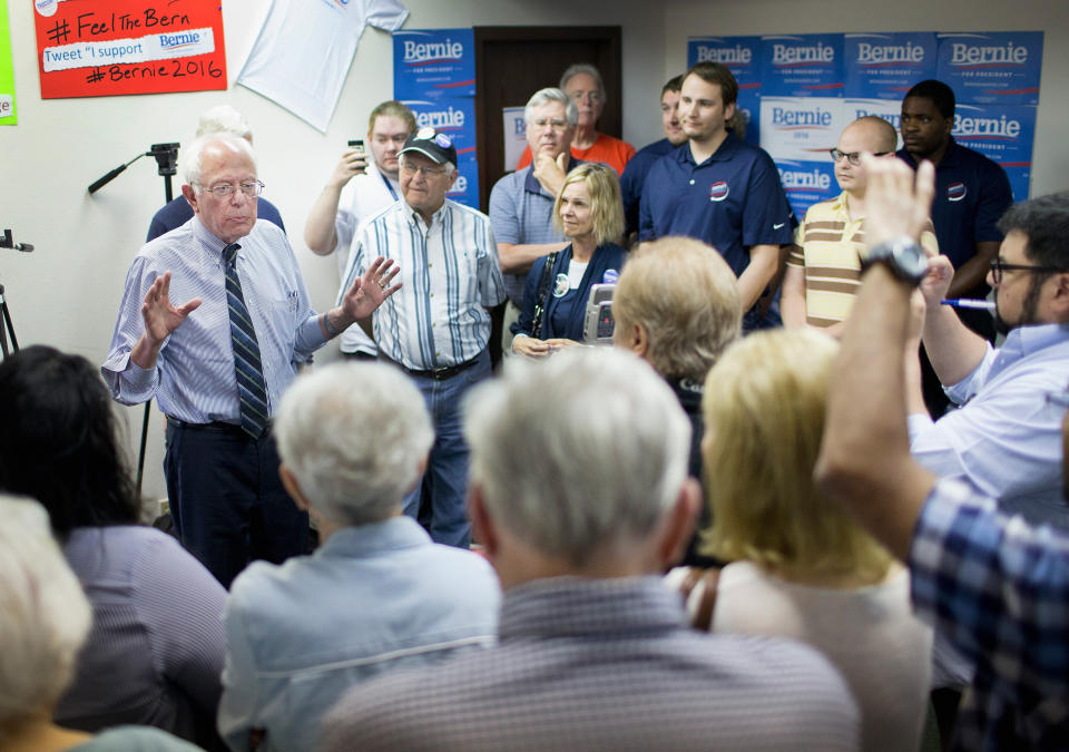 Sen. Bernie Sanders chats with supporters during a visit to his Iowa campaign headquarters on June 13, 2015 in Des Moines, Iowa.