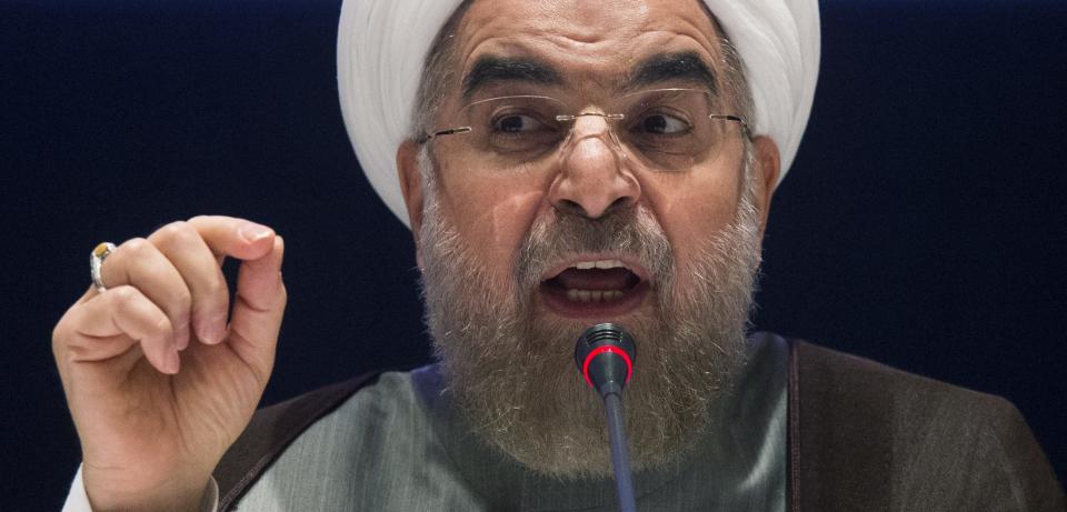 Iran's President Hassan Rouhani replies to a question during a news conference on the sidelines of the 69th United Nations General Assembly at United Nations Headquarters in New York September 26, 2014. Rouhani said on Friday "courageous decisions" must be made to clinch a long-term nuclear agreement and that any deal without the lifting of all sanctions against Tehran was "unacceptable". REUTERS/Adrees Latif (UNITED STATES - Tags: POLITICS)