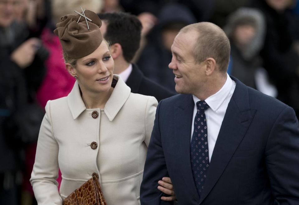 FILE - Zara Phillips and her husband rugby player Mike Tindall in this file photo dated Tuesday, Dec. 25, 2012, as they arrive for a traditional Christmas Day church service in Sandringham, England. Buckingham Palace announced Friday Jan, 17, 2014, that Queen Elizabeth II's granddaughter Zara Phillips and Mike Tindall have given birth to a 7 pounds, 12 ounces (3.5 kilograms) baby girl at Gloucestershire Royal Hospital. (AP Photo/Matt Dunham, FILE)