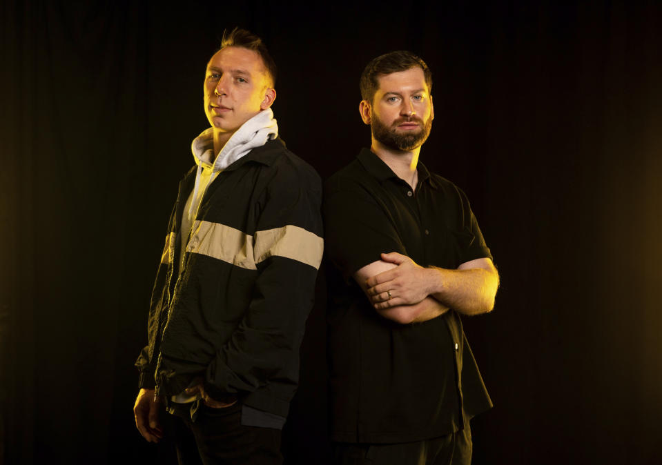 Clayton Knight, left, and Harrison Mills of ODESZA pose for a portrait at Angel of the Winds Arena on Monday, July 18, 2022, in Everett, Wash. (AP Photo/Lindsey Wasson)