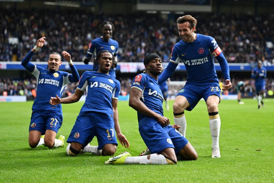 Noni Madueke (front) celebrates with teammates after scoring Chelsea’s fourth goal (Chelsea FC/Getty)