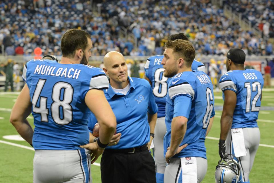 Pastor Dave Wilson, center, the chaplain of the Detroit Lions from 1985 to 2008 and co-founder of Kensington Church, during a game with long snapper Don Muhlbach on left and punter Sam Martin. Photo is from 2013 or 2014.