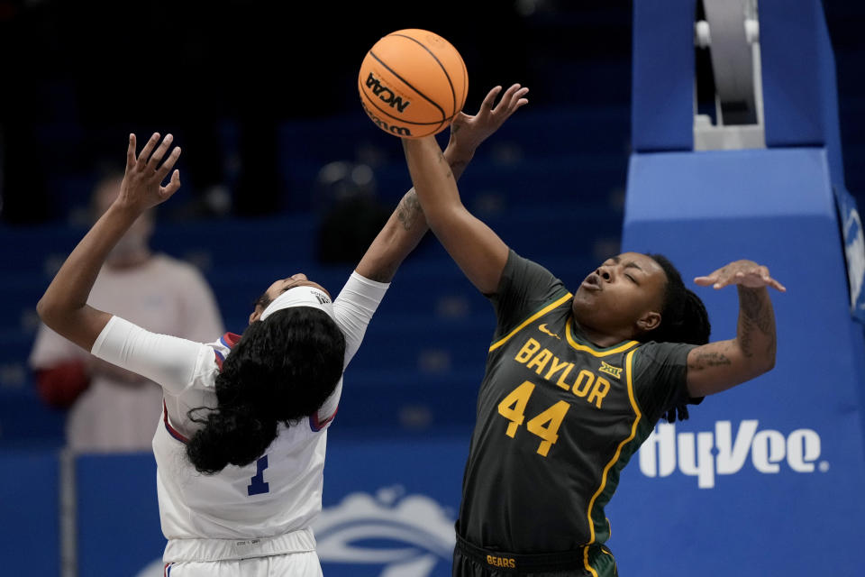 Baylor forward Dre'Una Edwards (44) blocks a shot by Kansas center Taiyanna Jackson (1) during the first half of an NCAA college basketball game Wednesday, Jan. 10, 2024, in Lawrence, Kan. (AP Photo/Charlie Riedel)